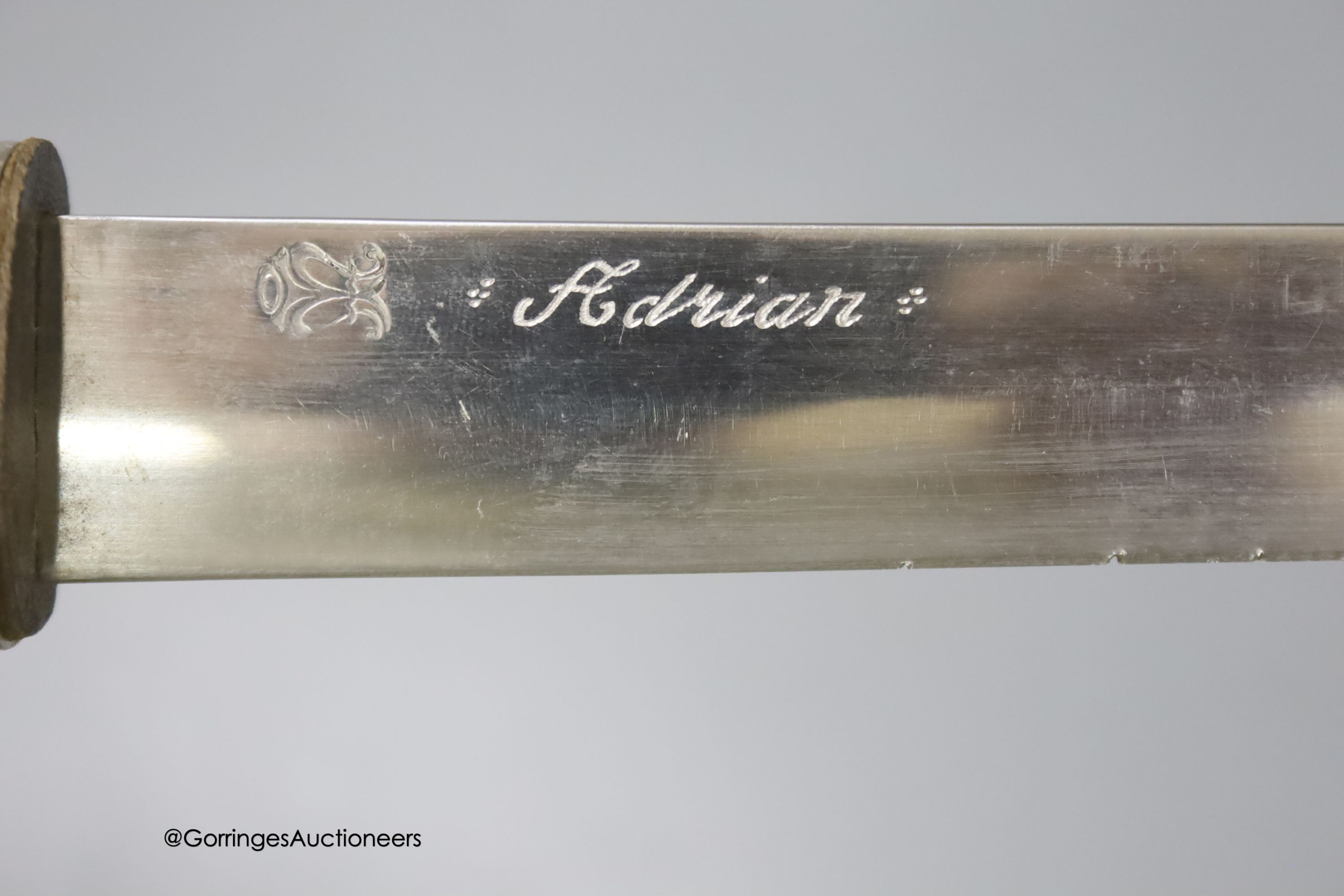 A Japanese short sword within embossed scabbard, blade 19cm
